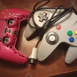 Gray and Pink Video Game Controllers